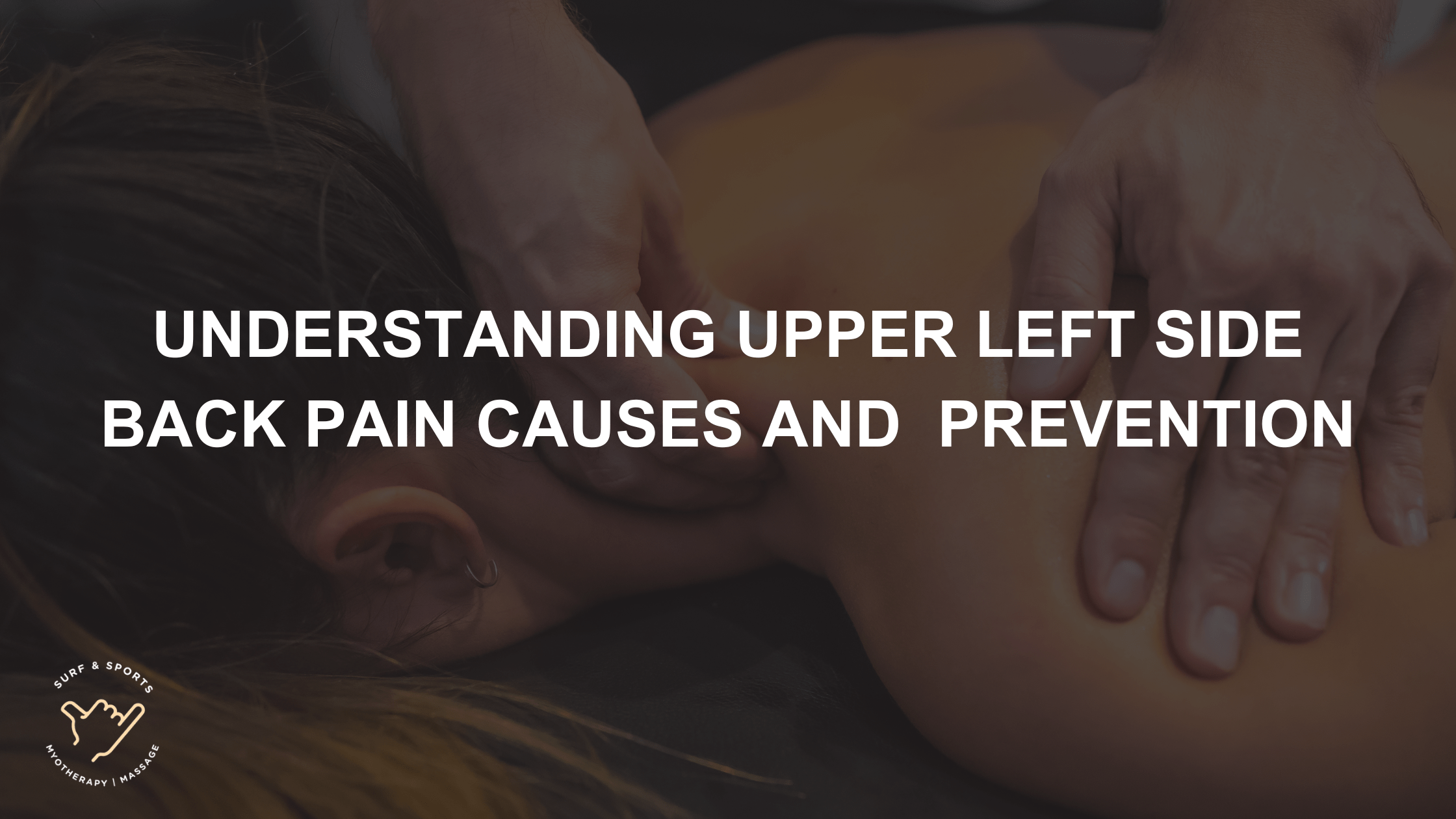Therapist hands applying massage to upper left back